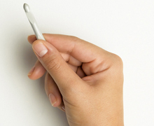 holding a crochet hook